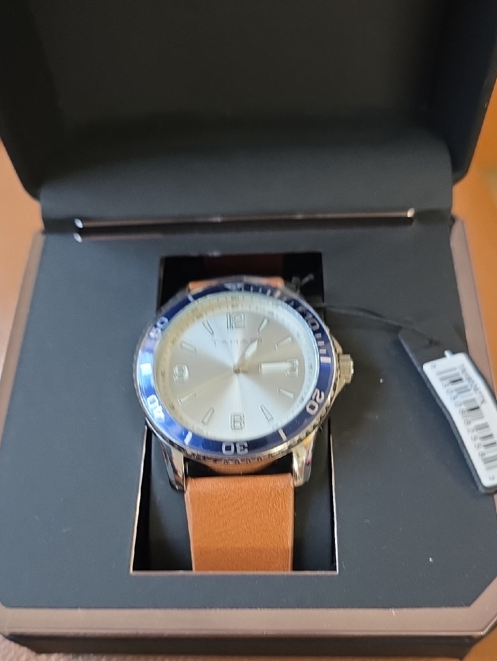 Tahari Silver Dial Watch with Blue Bezel and Brown Strap